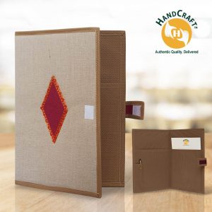 FF 010 composite: light neutral cover, burgundy diamond and brown edging; brown interior inset with two pockets, a pen holder, pen and paper.