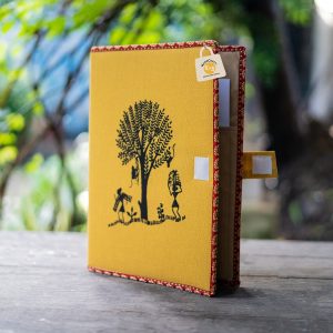 Mustard-yellow FF 013 with a dark tree-and-people motif, red-and-gold edging and an open side tab with pale fastening patches.