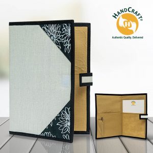 FF 009 B composite: pale grey cover with dark floral corners and dark edging; interior inset with two pockets, a pen holder, pen and paper.